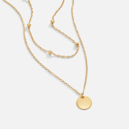 Lager-på-lager halsband med berlocker